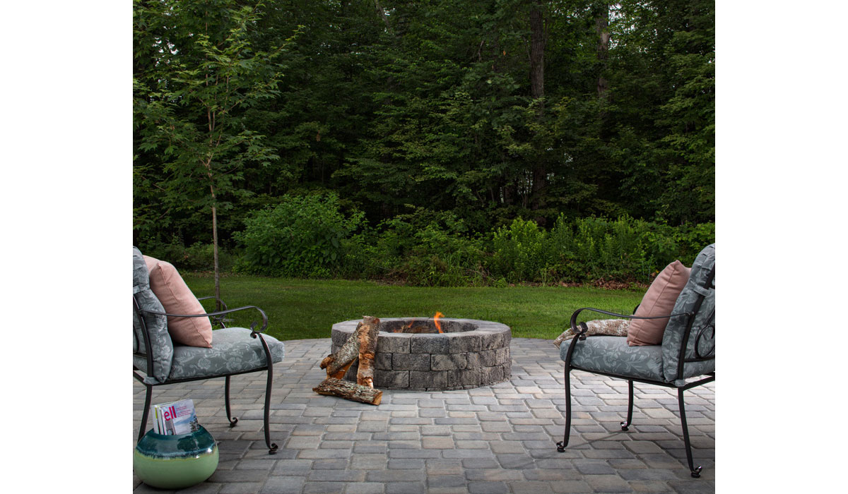 Firepit ontop of Cobblestone Paver Patio